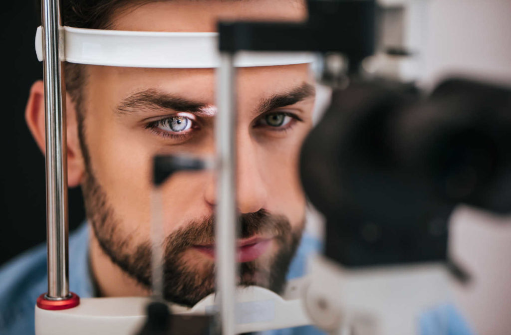 A patient at the eye doctor getting evaluated after a concussion so the optometrist can create a personalized vision therapy program