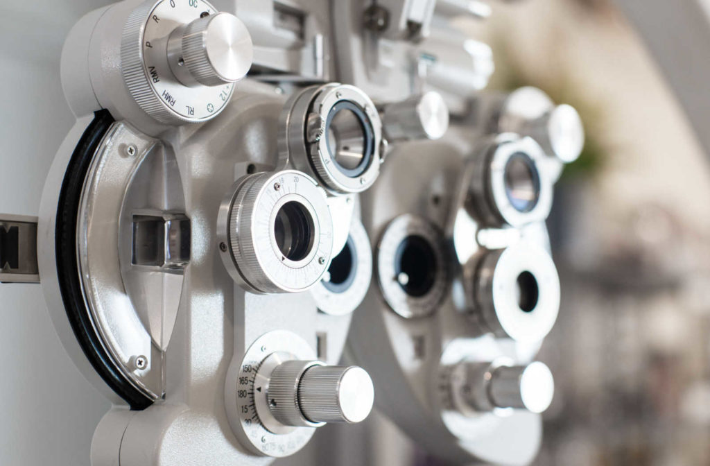 A close up of a phoropter in an eye exam room