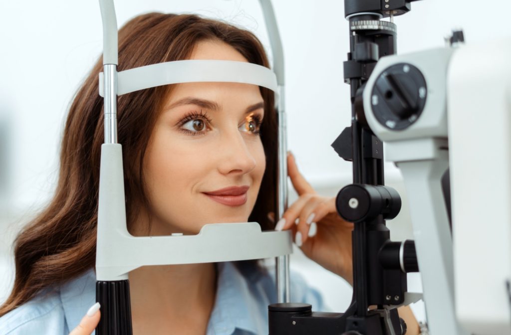 a woman is undergoing a comprehensive eye exam to maintain her eye health.