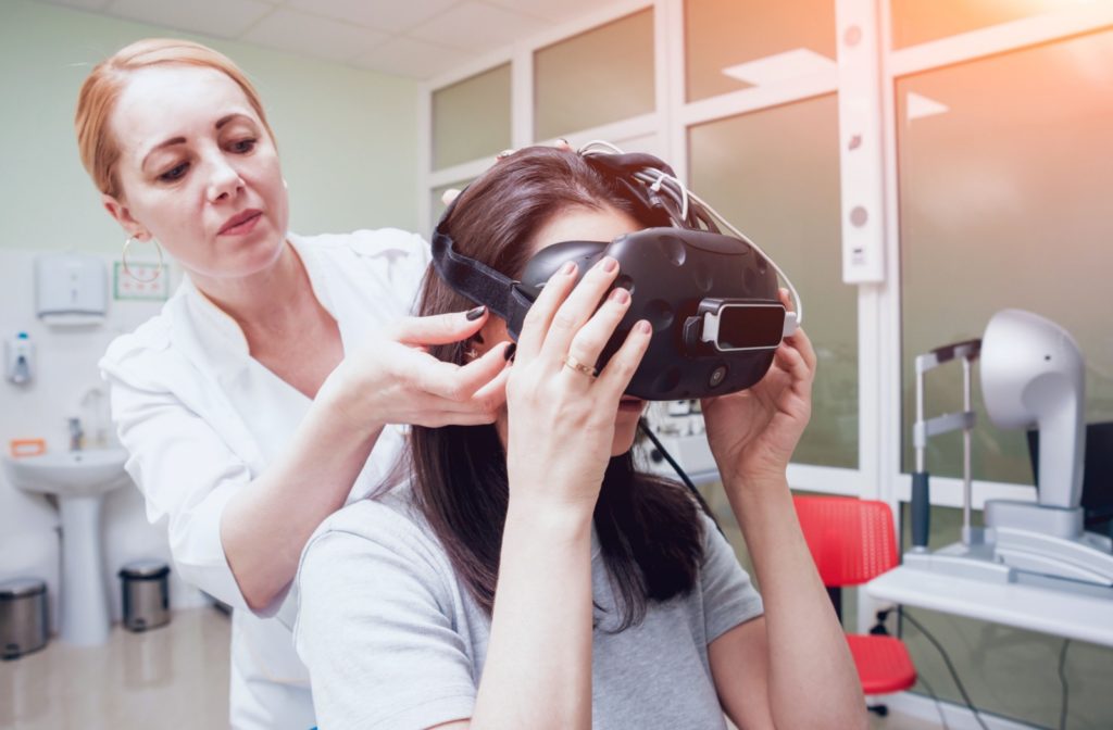 A person with visual vertigo sits with their head in their hands while the scene around them becomes blurry.