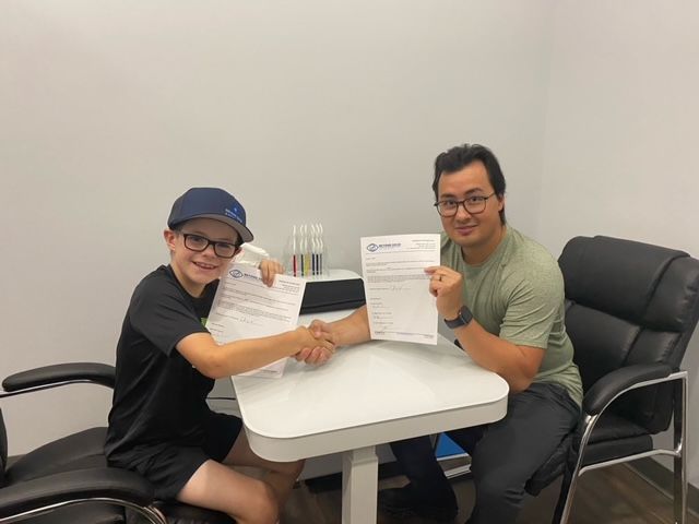 We are proud to give back to the community each year by sponsoring multiple youth and adult athletes/teams! Although we cannot sponsor every request, we are proud to take part in the development of youth in sports and academics. 
This summer we had the pleasure of signing our first "professional" baseball player! 
Meet Chase: A 5 foot slugger weighing in at ~85 lbs soaking wet. Chase embodies what it means to be a good athlete and young man. He works hard on and off the field, and we could not be more proud of him. Chase is a vision therapy graduate and we are proud to help his team make their way to Newfoundland for the Atlantic championships. Congrats to Chase's team the Moncton Cubs who brought home the gold medal!!